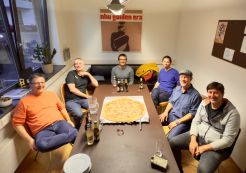 2nd meeting of the Drupal User Group Bodensee Six Drupal developers from the User Group Bodensee sit around a table with a large pizza in the middle